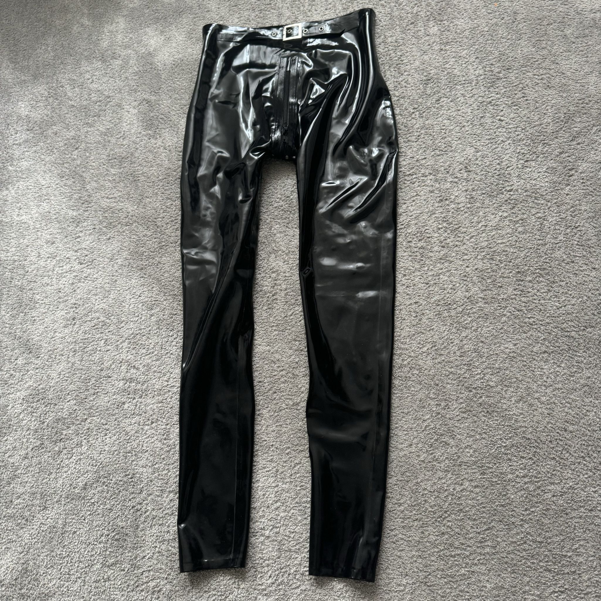 WORN LATEX PANTS WITH ZIPPERS