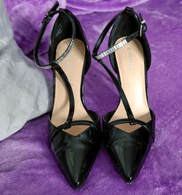 Worn Black High Heels