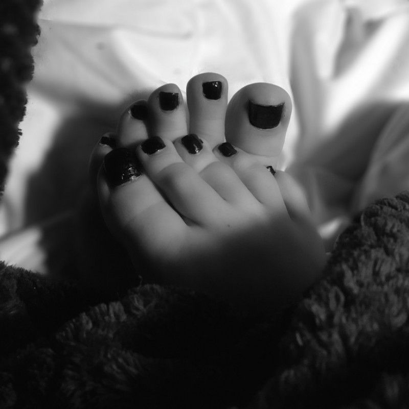 color photo set of feet in blanket