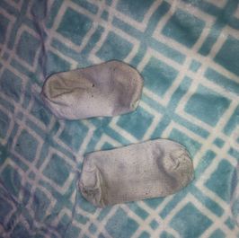 Very dirty worn ankle socks