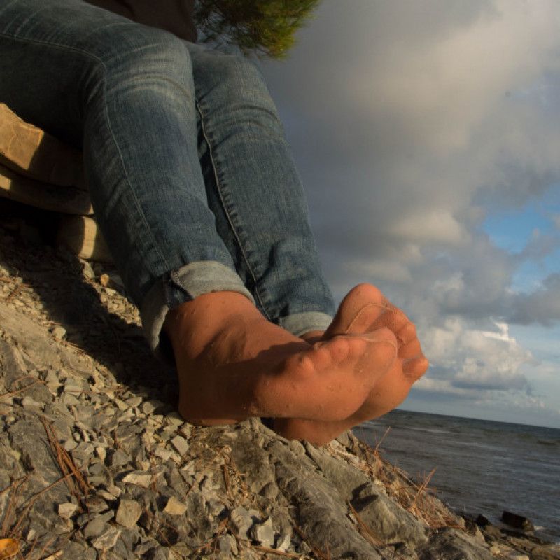 Lovely everyday nylon feet in jeans at the seashore