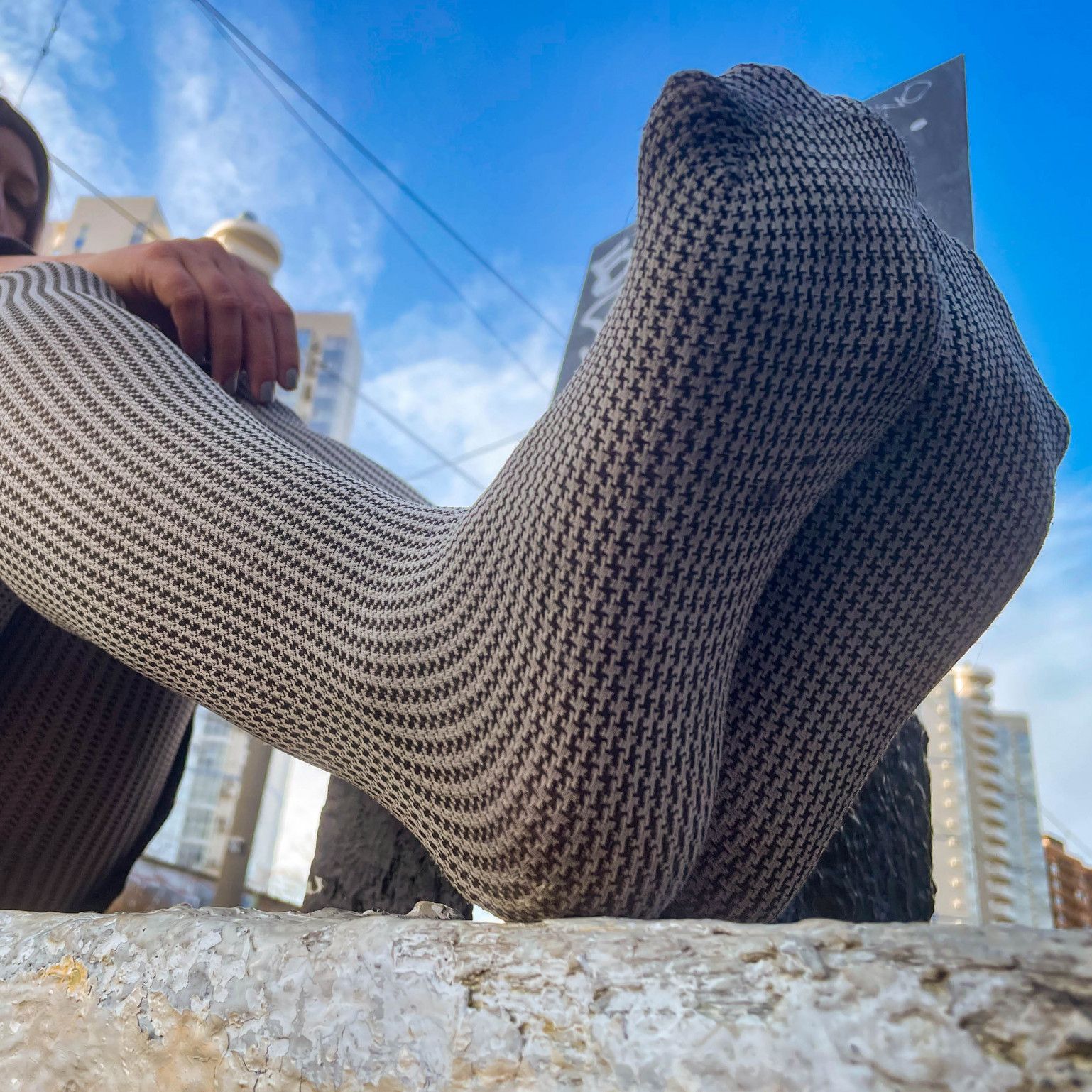 Goddess feet closeups in gray opaque tights outdoor