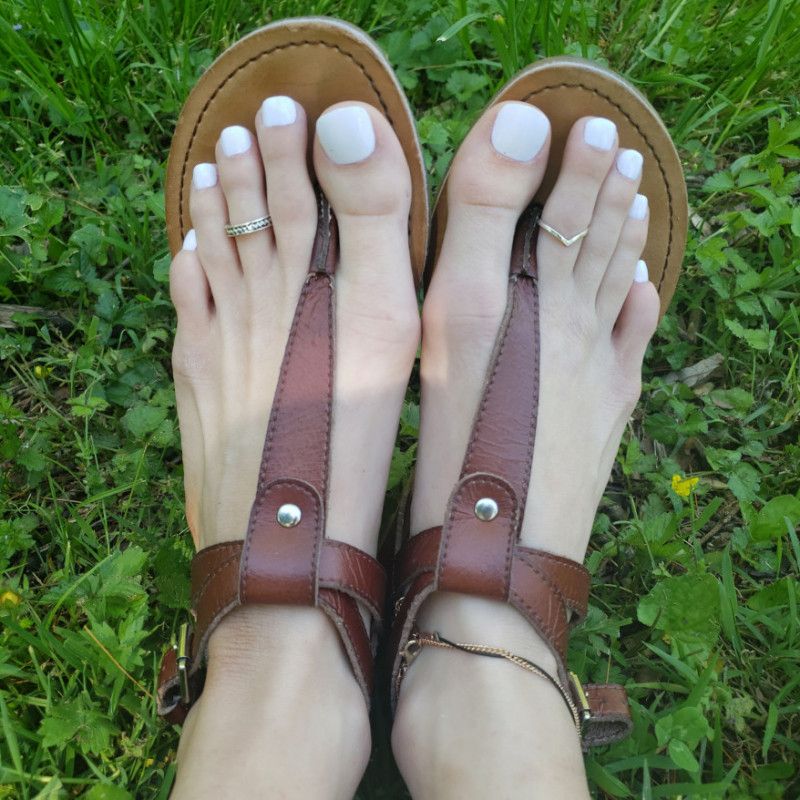 Outdoors with perfect white pedicure