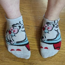 Worn white rabbit socks