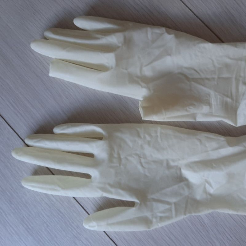 Worn white latex gloves