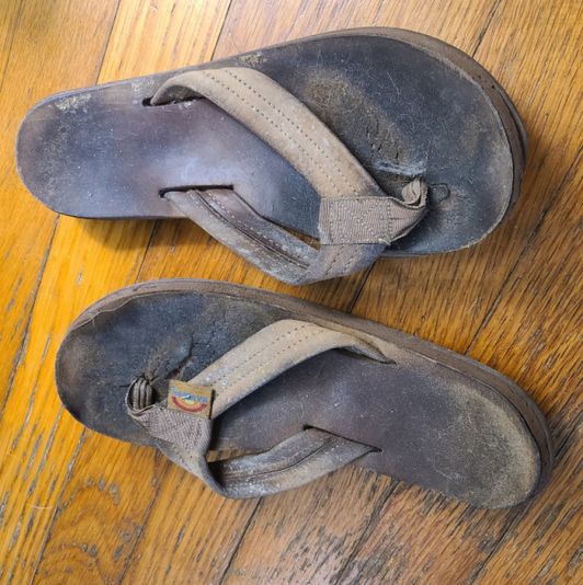 Worn Rainbow Flip Flops