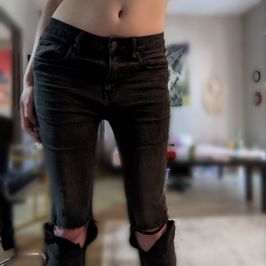 Worn Black Ripped Jeans