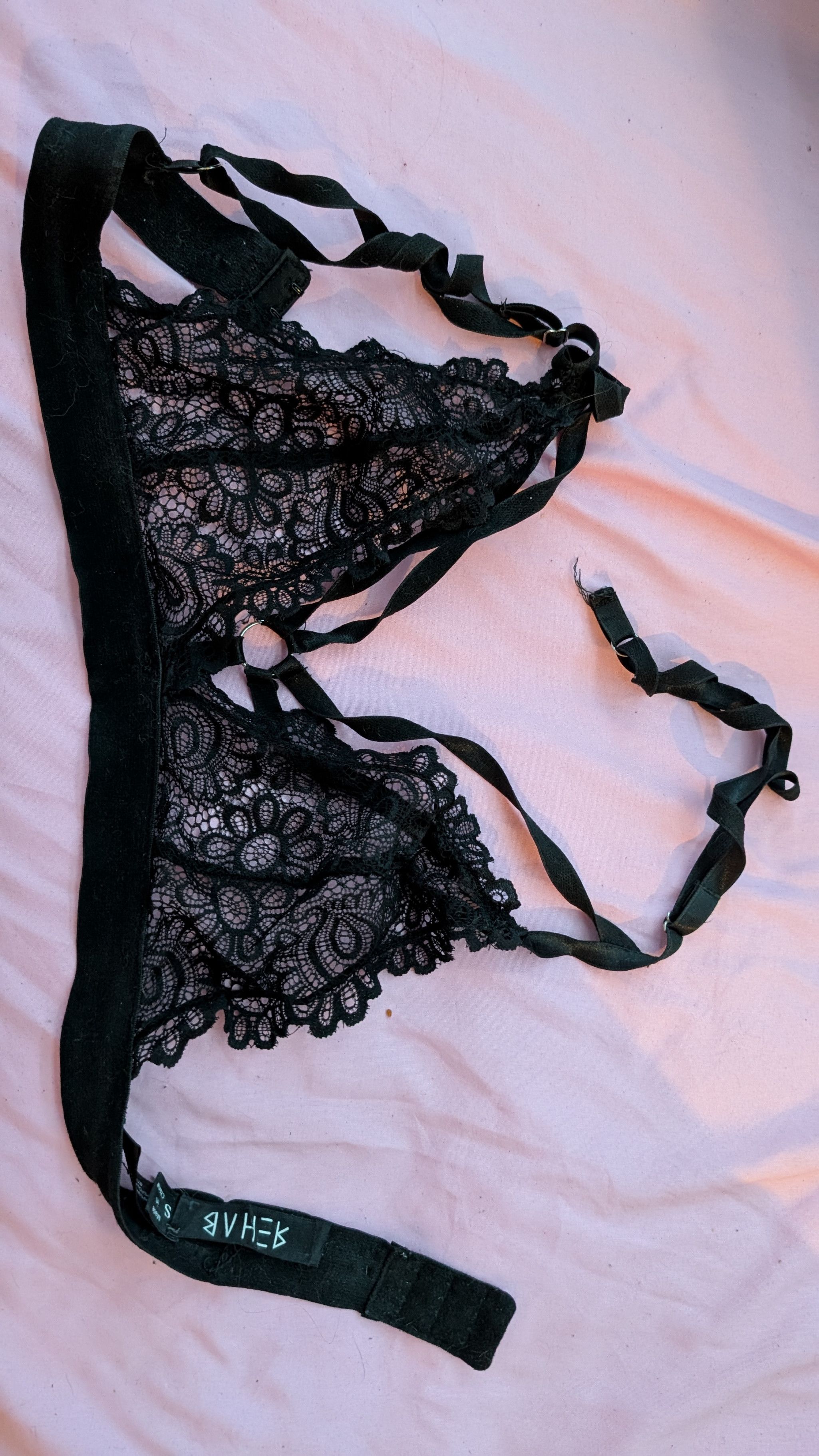 Strappy and Lacey black bralette with a broken strap