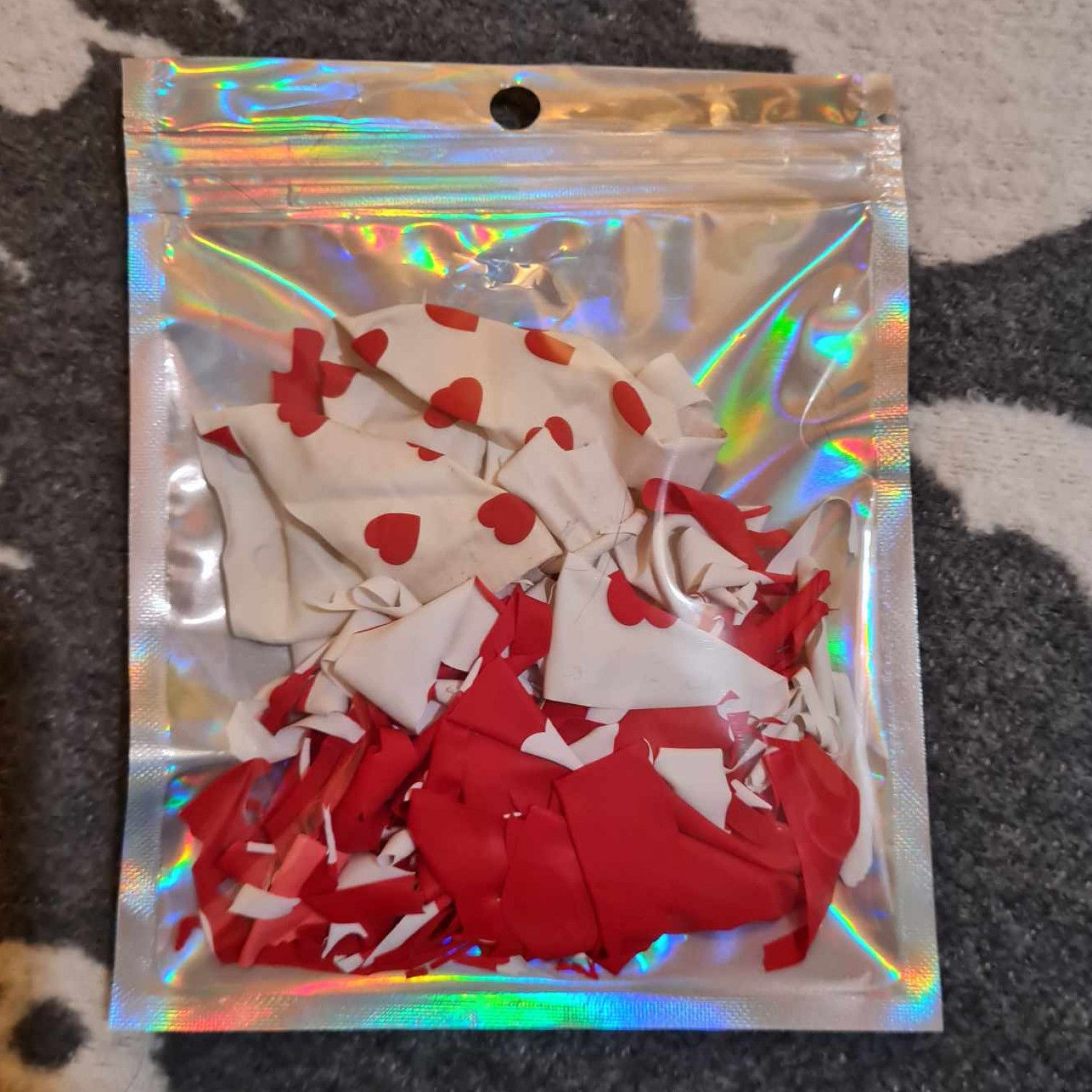 Popped heart print balloon bits