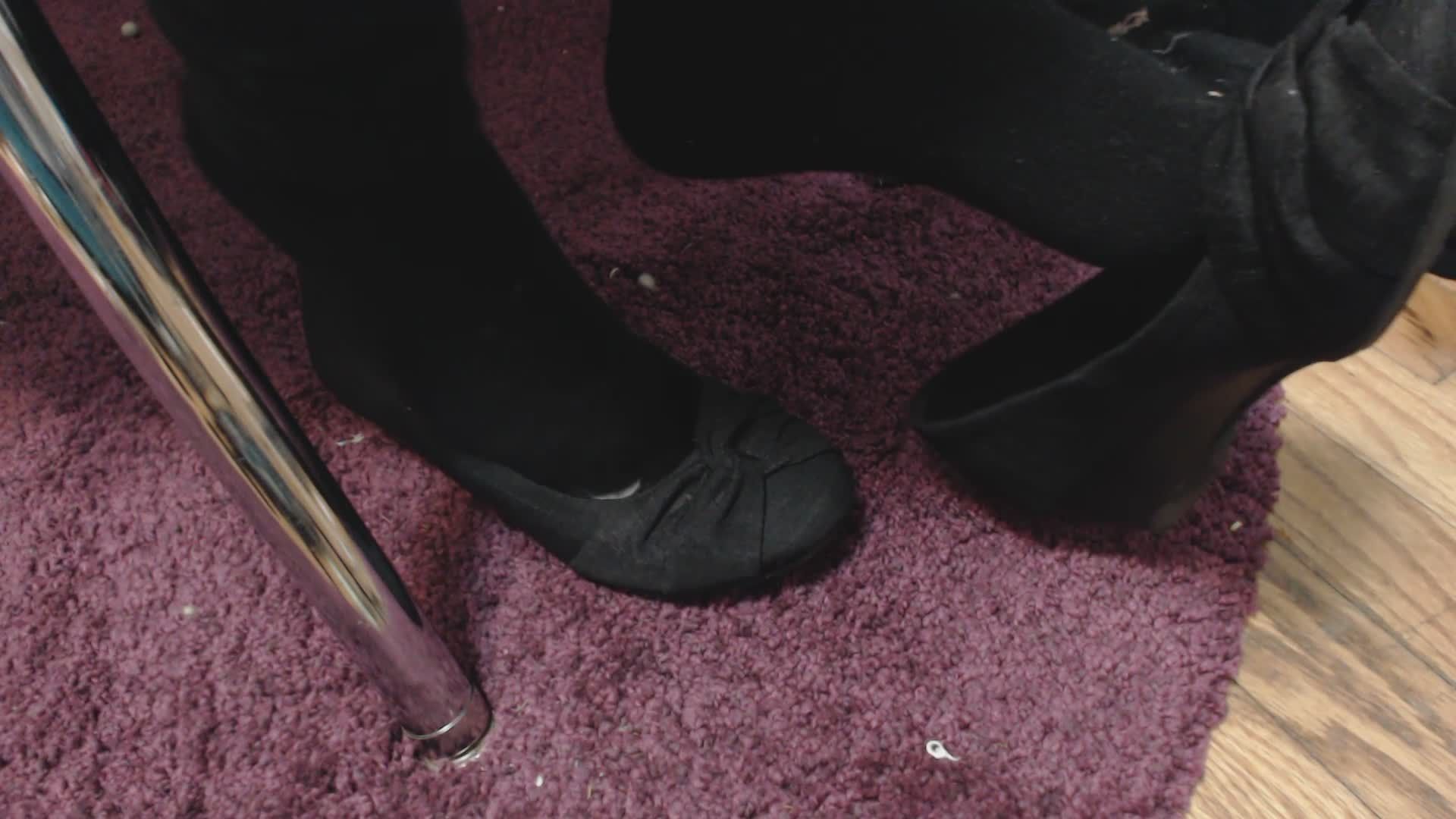 Dangling Black Shoes in Black Socks