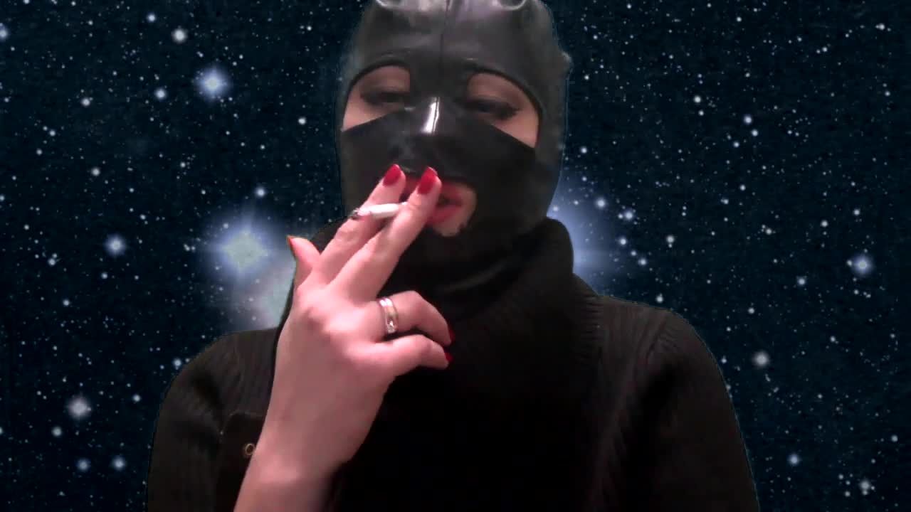 Smoking and teasing you in a latex mask