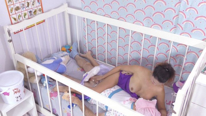 A breast feed and benefits in his cot