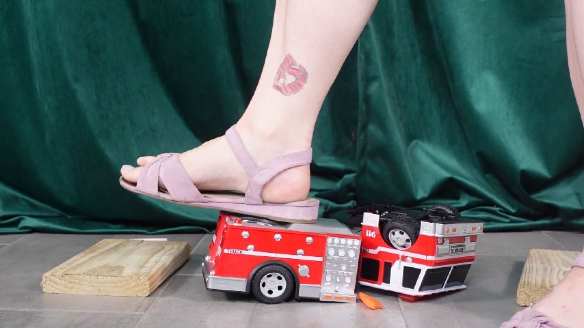 Toy Car Ambulance Crushed by Feet in Purple Sandals