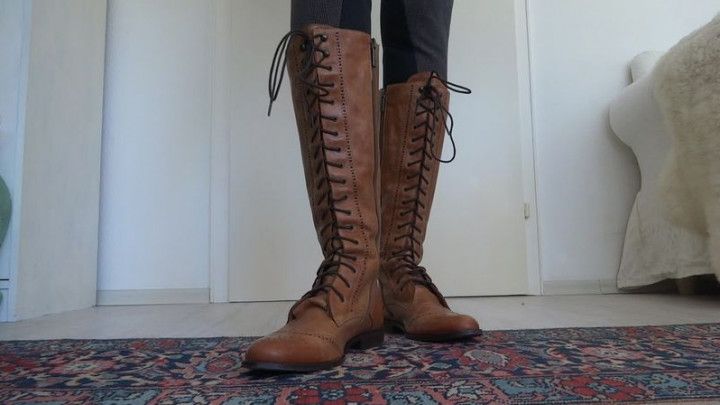 Brown lace-up boots show