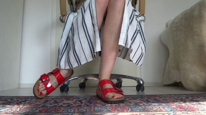 Red patent leather slippers with a dress