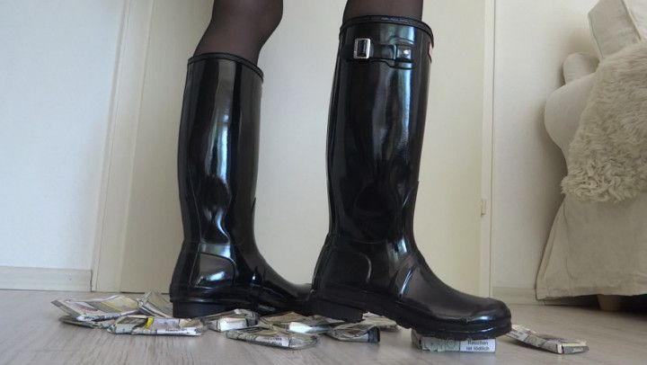 Rubber boots crush cigarette packs and boots squeak