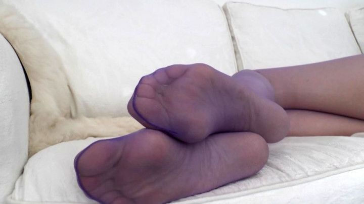 Close-up of purple pantyhose soles