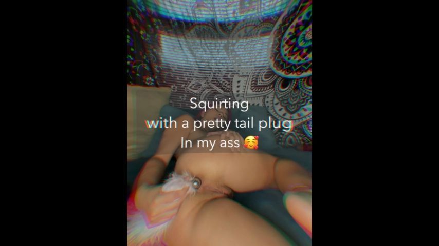 Squirting with a pretty tail plug in