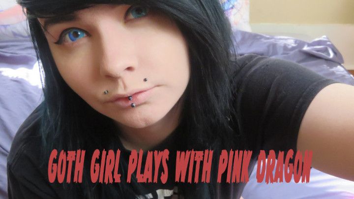 goth girl plays with pink dragon