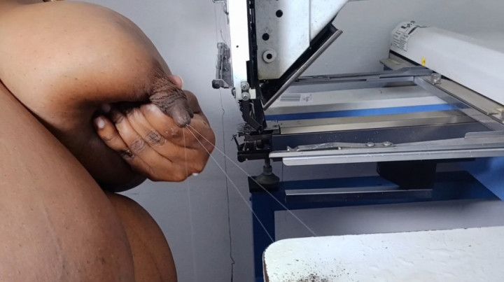 Employee spraying breastmilk on machines