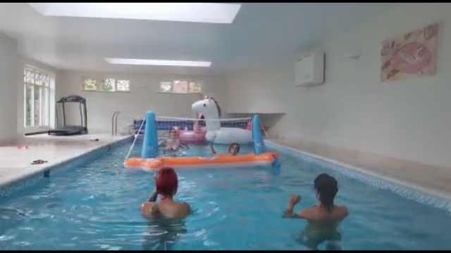 Just 4 sex workers playing volleyball in a pool