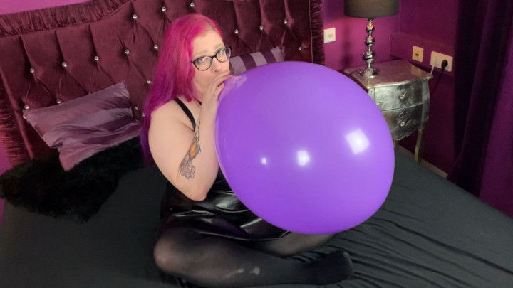 Blowing up and sit to pop big balloon