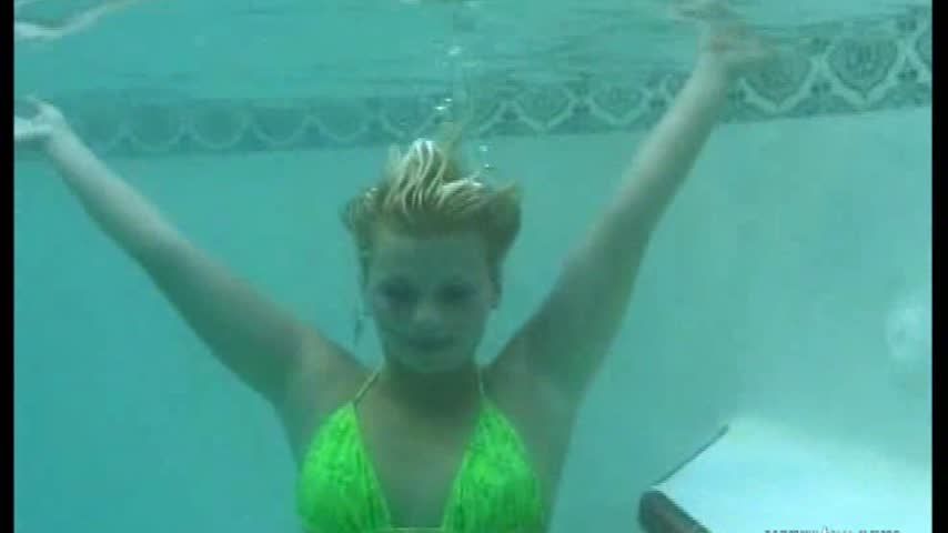 Shawna underwater in a green bikini