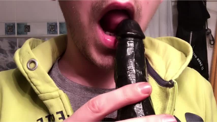 Sucking The Black Dildo