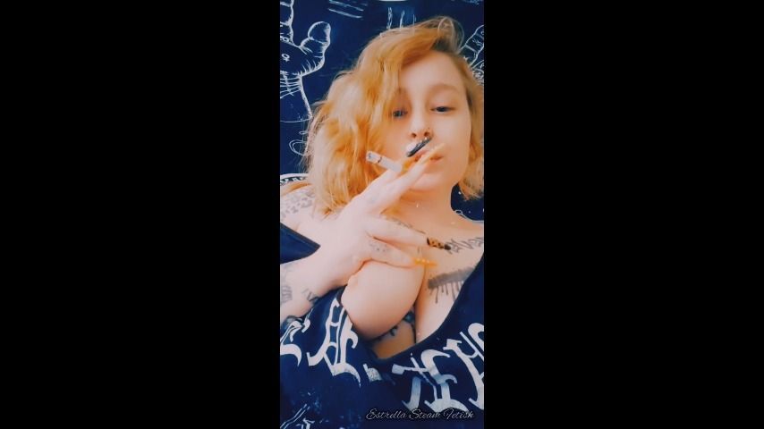 Metal girl smokes a cigarette