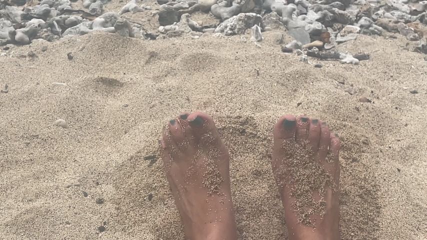 rubbing my feet in the sand