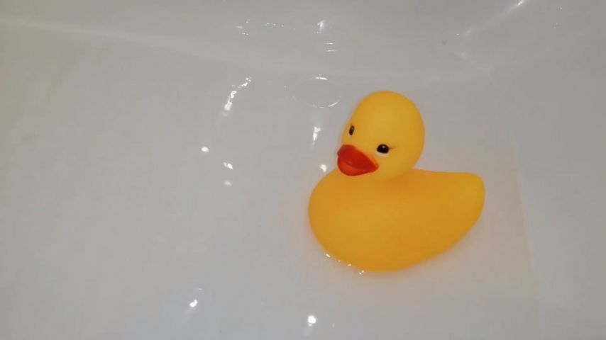 Playing in the bathtub with rubber duck