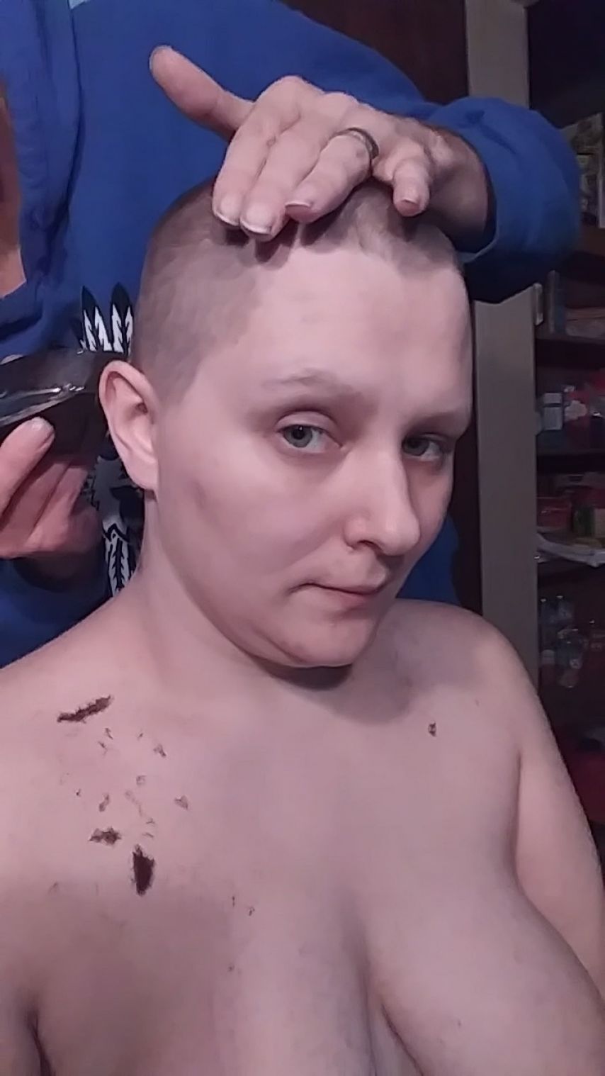 Shaving her bald