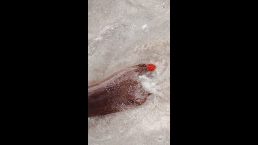 Morning bare feet walk at the beach