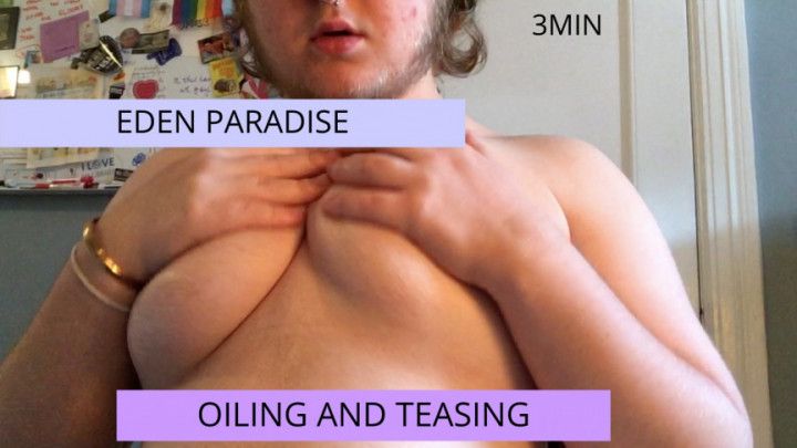 trans guy oiling his chest up