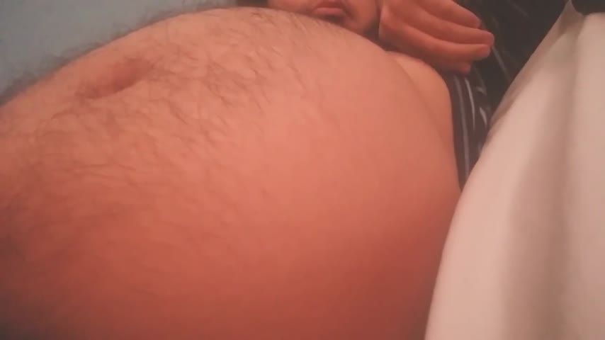 Lying on bed with my fat belly