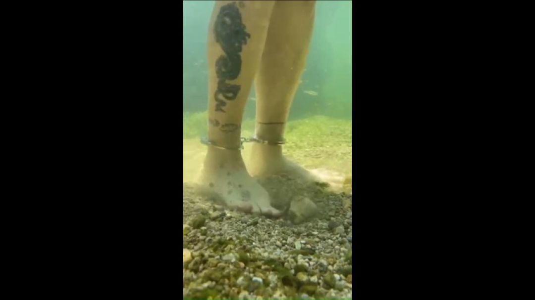 Underwater cuffed feets