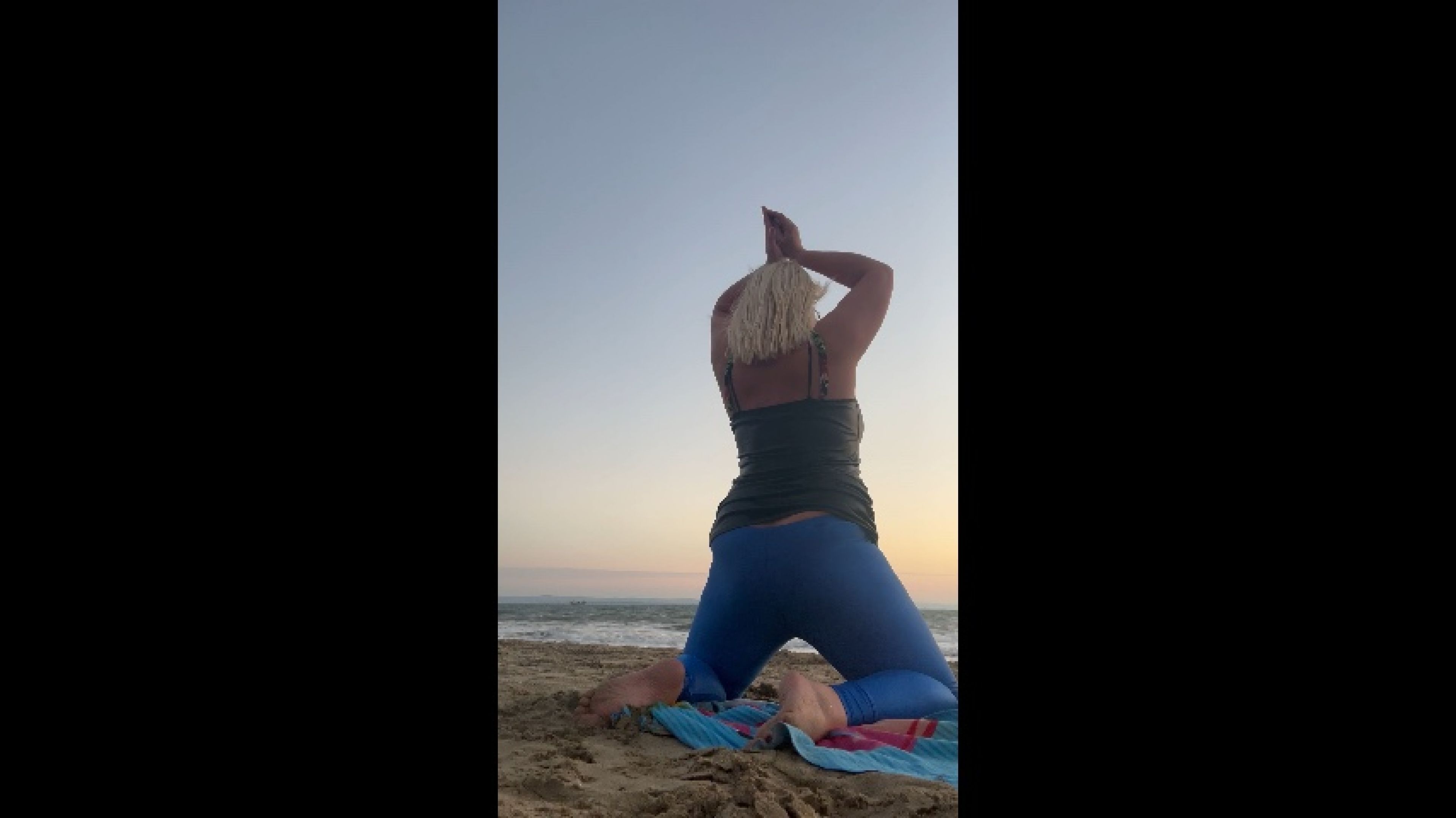 Yoga and photo shooting on the public beach at the sunrise