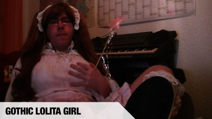 Gothic Lolita girl gets off to porn