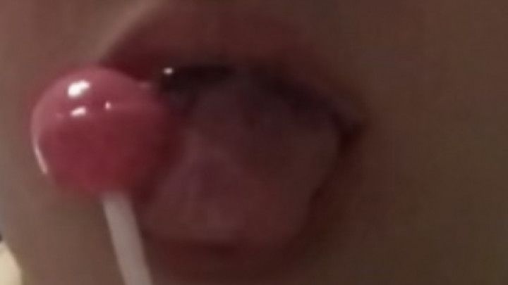 Girl sucks and drools all over lollipop