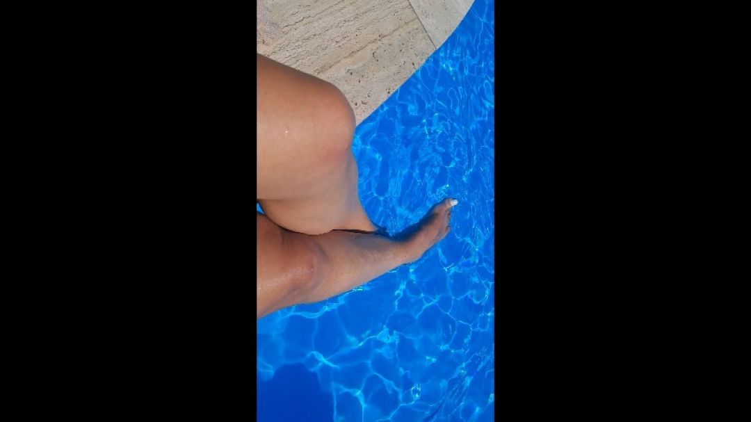 Sexy legs playing in the pool