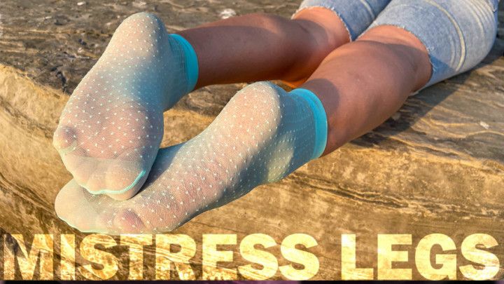 Sexy Soles In Cute Turquoise Nylon Socks On The Seashore