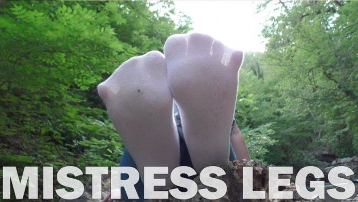 Feet In White socks at the waterfall