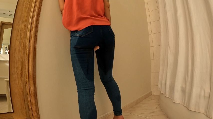 Tight jeans wetting on a dildo