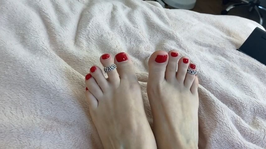 My red pedicure and toes rings