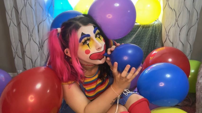 Clown Girl Blows Up Balloons