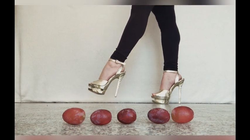 Heels teasing and crushing grapes