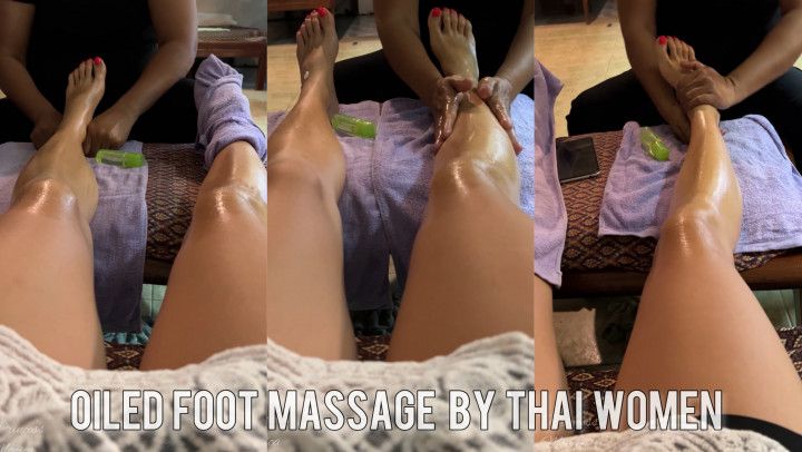 Oiled foot massage by Thai women