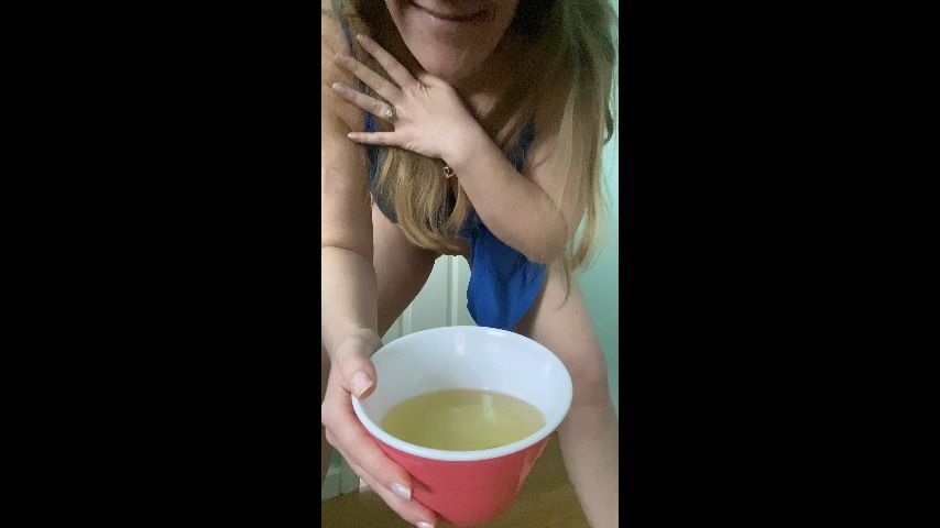 Blonde MILF fills a bowl with her pee out of desperation