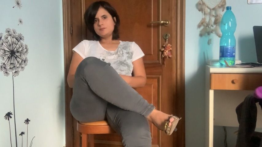 crossed legs with jeans and high heels