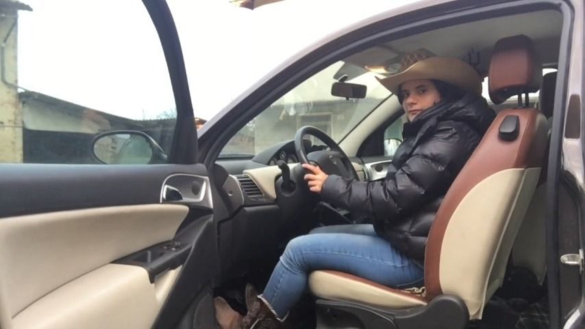 a cowgirl is pedal pumping with her car